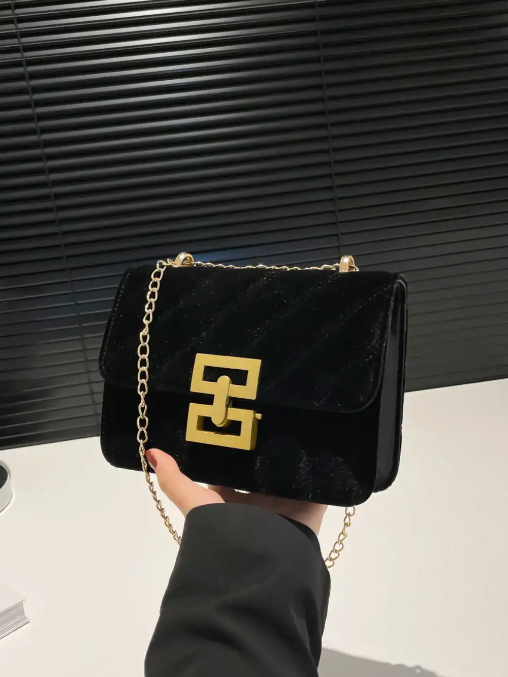 Compact quilted crossbody bag